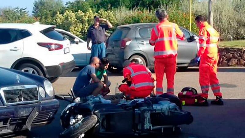 Ambulance personnel attend to George Clooney after being involved in a crash near Olbia, on the Sardinia island. Photograph:AP Photo/Mario Chironi