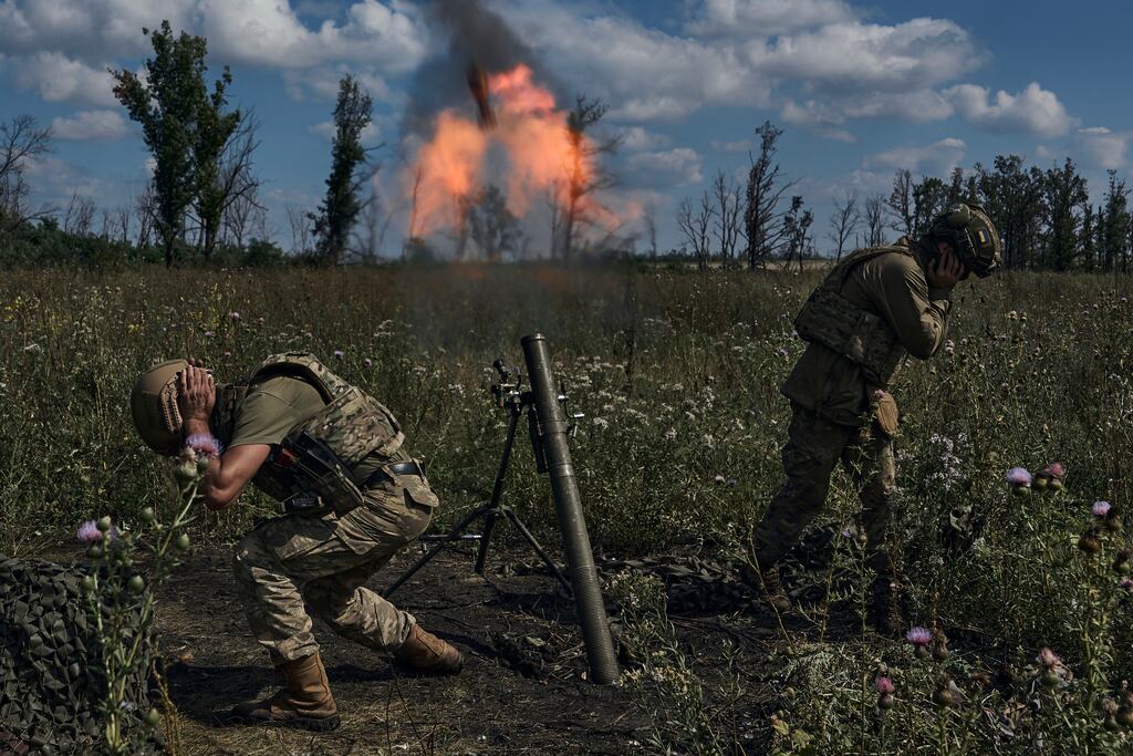 Ukrainian soldiers fire a mortar towards Russian positions at the front line, near Bakhmut, Donetsk region, Ukraine. Photograph: Libkos/AP
