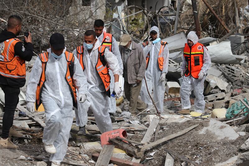Palestinian civil defence personnel search for bodies amidst the rubble of buildings in a ruined neighbourhood of Gaza's southern city of Rafah, on on Wednesday. (Photograph: Bashar Taleb/AFP via Getty Images