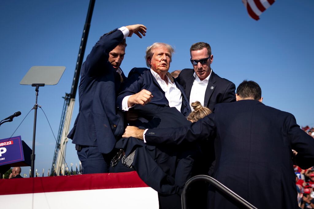 Donald Trump is surrounded by Secret Service agents after the shooting in Butler, Pennsylvania. Photograph: Doug Mills/The New York Times