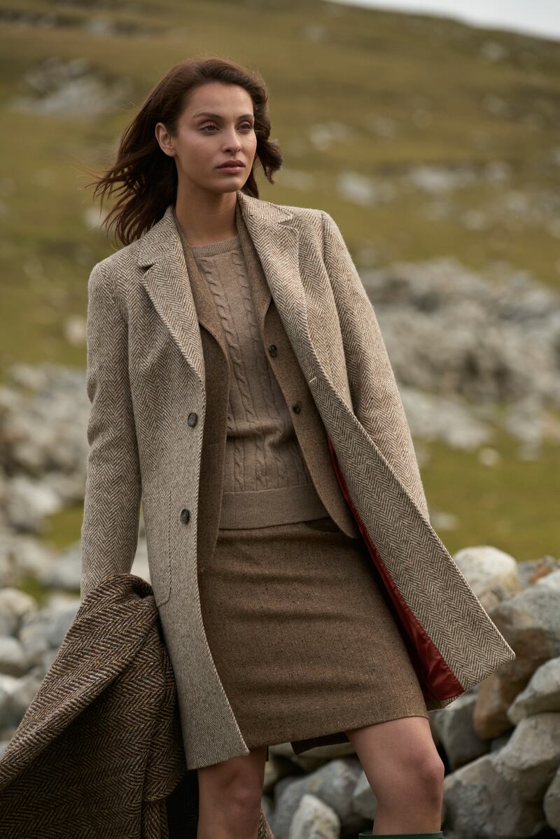 Emma Donegal tweed coat in cream and earthy brown herringbone, €499, with camel herringbone throw, €125.30, from Magee