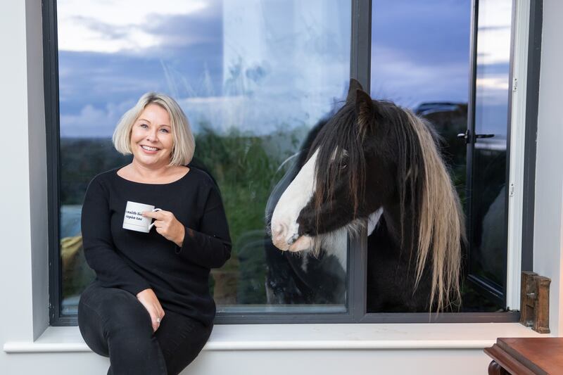 Elizabeth Birdthistle with Willow the horse at her new home, Doolough Lodge, in Co Mayo. Photograph: Ryan Gallagher