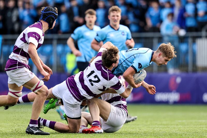 Clongowes' Callum McDonald tackles Jules Fenelon of St Michael’s College. Photograph: Ben Brady/Inpho