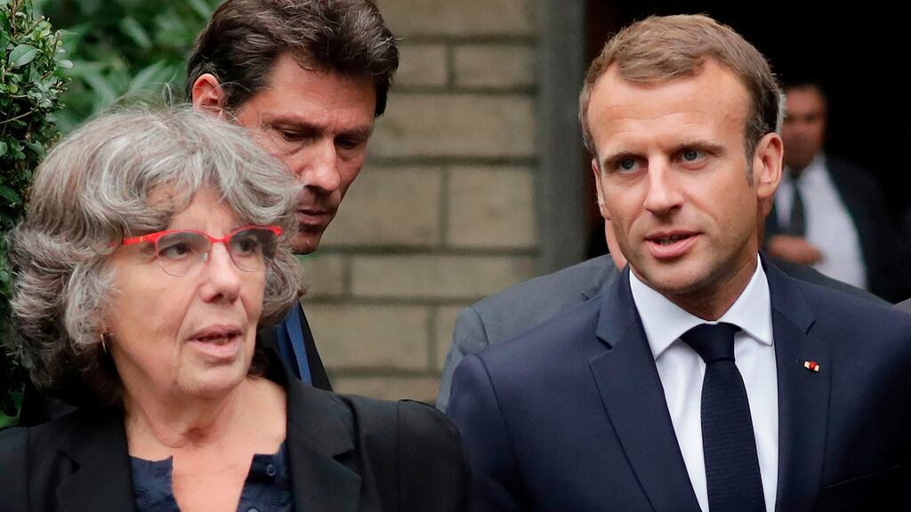French president Emmanuel Macron with Michele Audin, daughter of late Maurice Audin, as he leaves the home in Bagnolet of Josette Audin, widow of Audin, on Thursday. Photograph: Thomas SamsoN/AFP/Getty Images