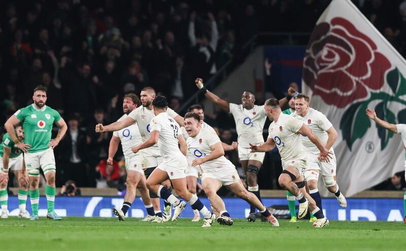 England’s Marcus Smith and his team-mates celebrate the crucial late drop goal which snatched victory over Ireland at Twickenham. Photograph: Andrew Fosker/Inpho