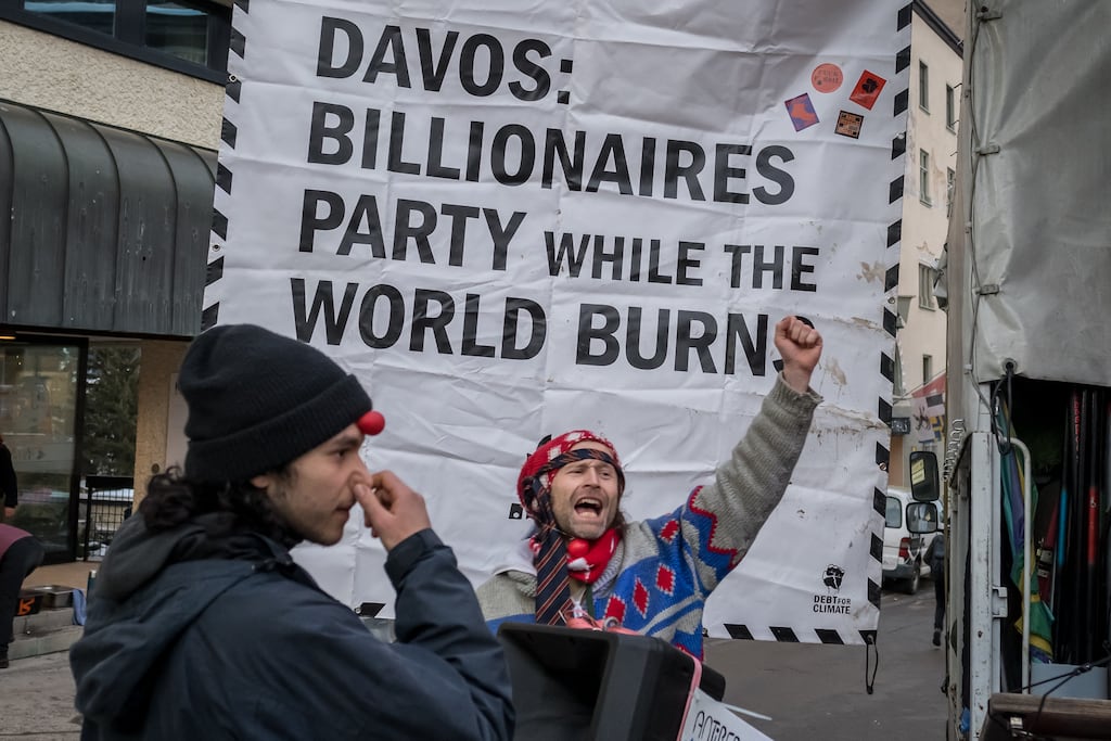 Protesters take part in a demonstration against the World Economic Forum ahead of its annual meeting in Davos. Photograph: Fabrice Coffrini / AFP via Getty Images