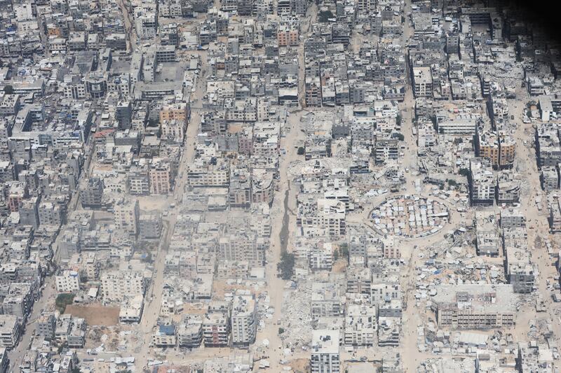 A view from the air as aid drops from a Jordanian C-130 military aircraft on Wednesday in Gaza. Photograph: Salah Malkawi/Getty