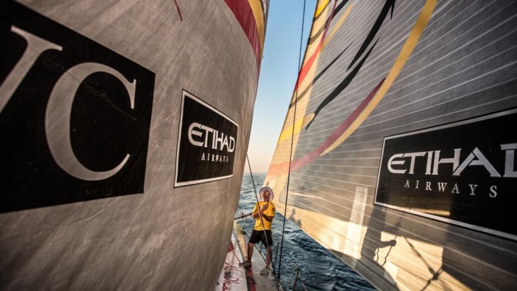 Justin Slattery on board Abu Dhabi Ocean Racing adjusts trim in the staysail as winds build along the Iranian coastline during the third leg of the Volvo Ocean Road Race. Photo: Matt Knighton/Getty