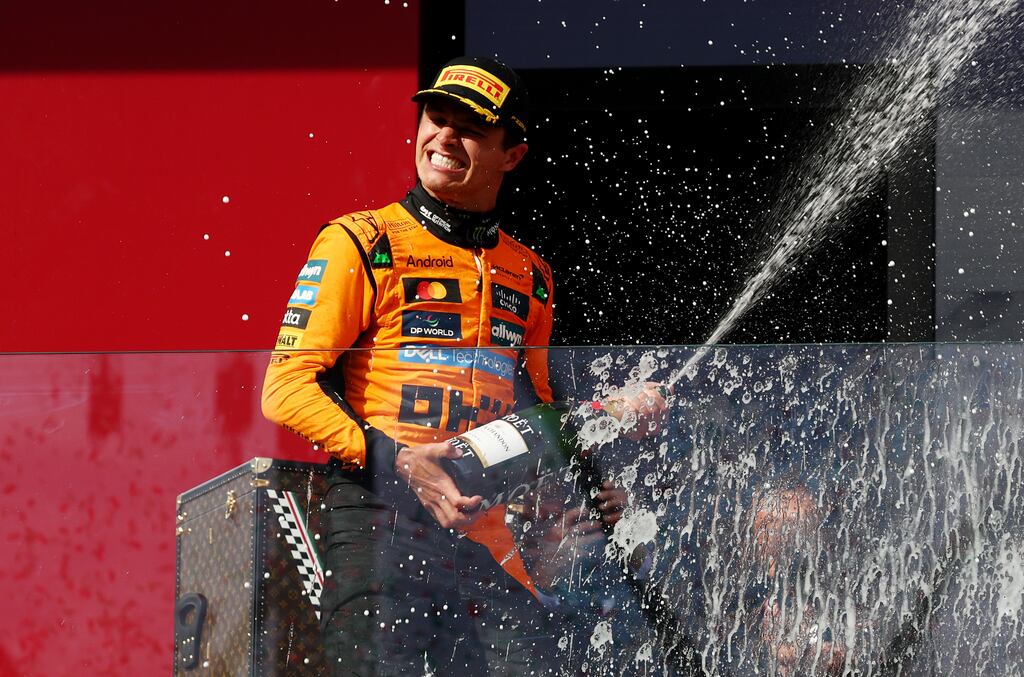 McLaren's Lando Norris celebrates on the podium after winning the Hungarian Grand Prix at the Hungaroring. Photograph: Clive Rose/Getty Images