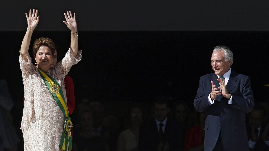 Brazil’s vice president Michel Temer applauds Dila Rousseff during her inauguration as president in January 2015. Photograph: Marcelo Sayao/ EPA