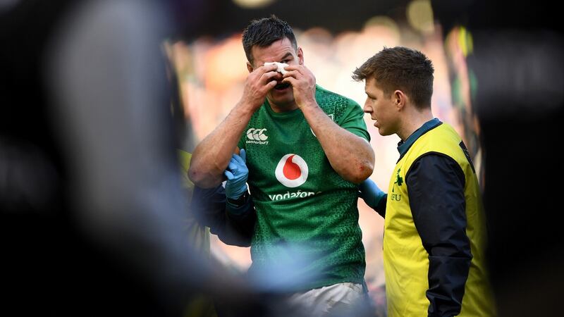 Sexton recieves medical treatment before being withdrawn at half-time. Photo: Stu Forster/Getty Images