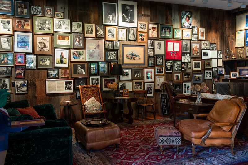 A wall of memorabilia and personal photos in the Newman family’s barn home. Photograph: Frances F. Denny/The New York Times