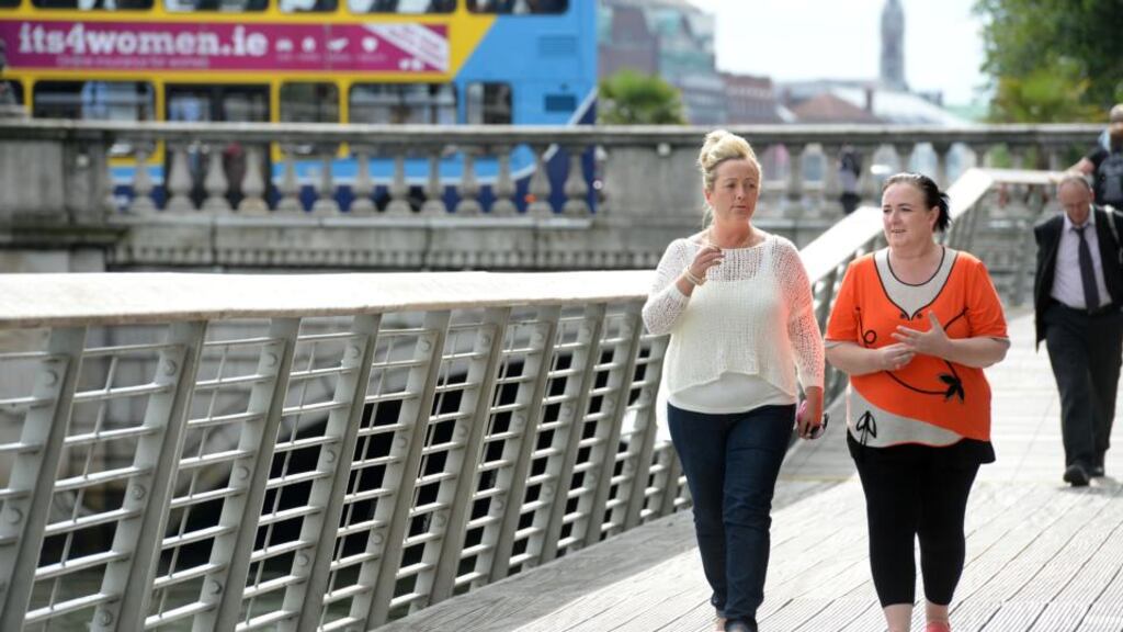 Danny Talbot’s aunts Donna (left) and Deborah Lamb in Dublin yesterday. Every week the sisters come to Dublin’s Liffey boardwalk in search of vulnerable young people to help. Photograph: Dara Mac Dónaill/The Irish Times