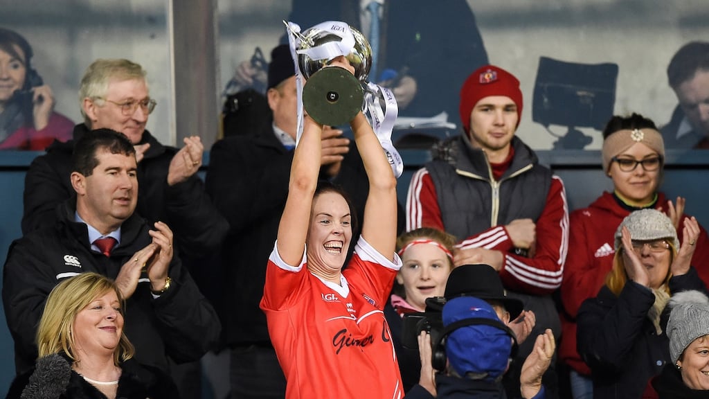 Donaghmoyne’s Amanda Casey lifts the LGFA All-Ireland senior club title at Parnell Park in 2016. Photograph: Tommy Grealy/Inpho