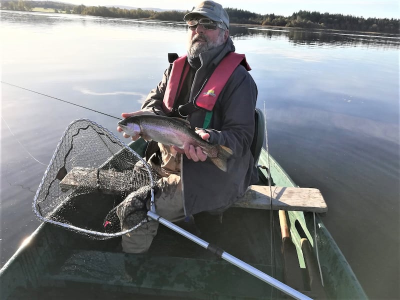 Tom (Swanky) Sweeney with a good-sized rainbow trout at Lake Menteith.