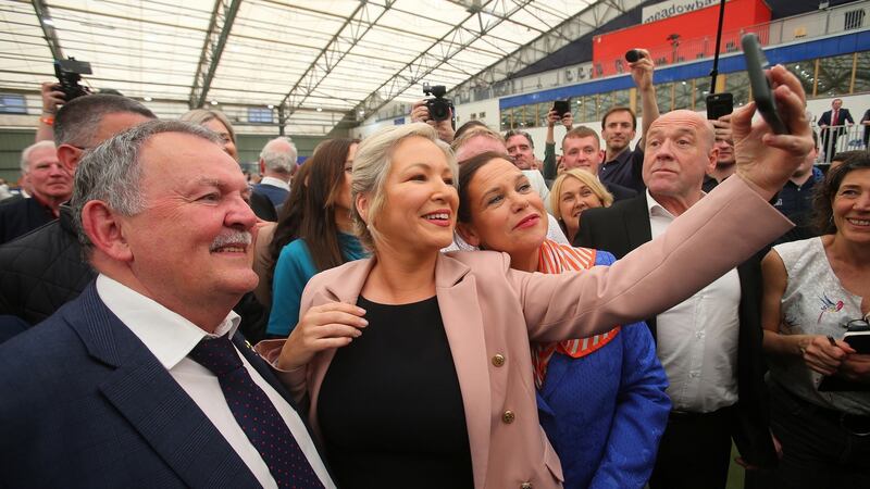 SSinn Féin vice-president Michelle O’Neill (centre) takes a selfie with party leader Mary Lou McDonald (right) at the Northern Ireland Assembly election count centre in Derry. Photograph: Stringer/EPA
