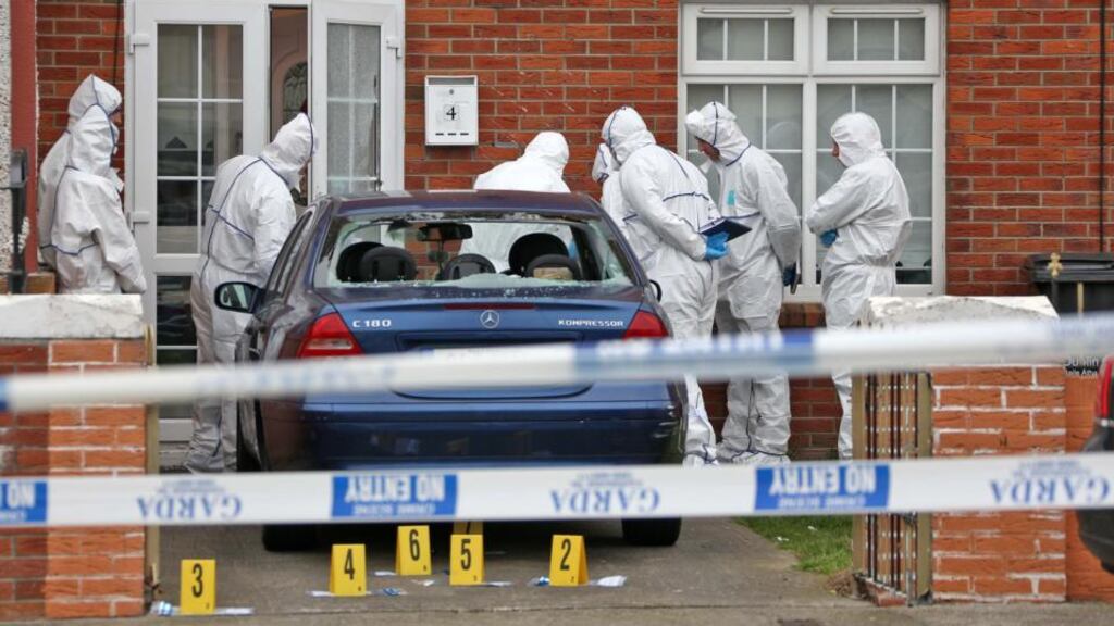 Gardaí at the scene on Clifden Drive, Ballyfermot, where two men were shot on Thursday night. Both men were taken to St James’s Hospital suffering from non life-threatening injuries. Photograph: Colin Keegan/Collins