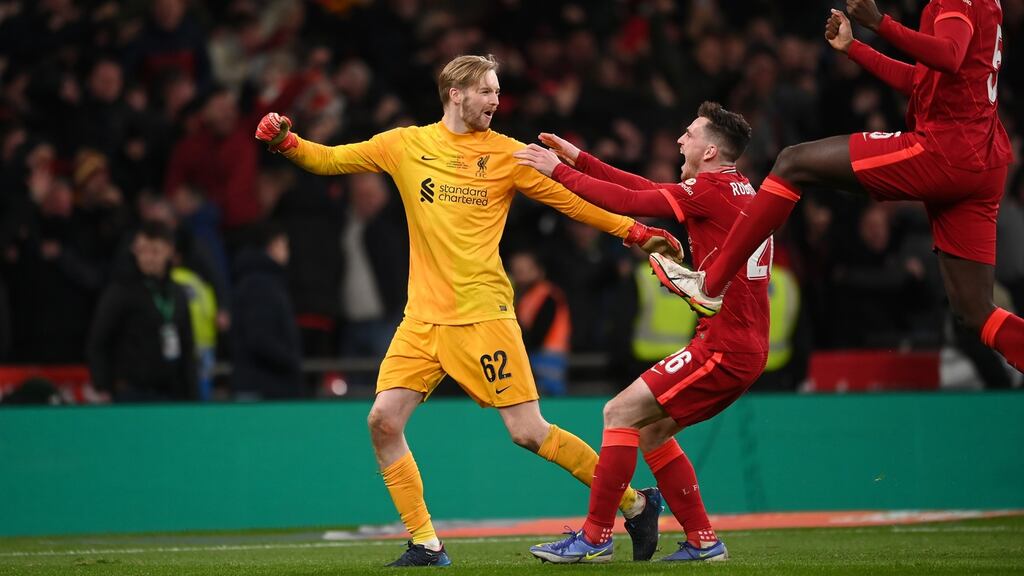 Caoimhin Kelleher celebrates with his Liverpool team mates after their penalty shoot out victory. Photograph: Michael Regan/Getty Images