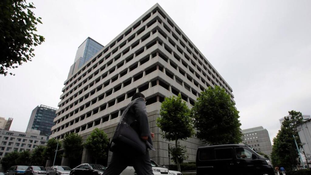 A man walks past the Bank of Japan headquarters in Tokyo. The bank said an economic recovery was underway as it kept monetary policy steady today. Photograph: Toru Hanai/Reuters.