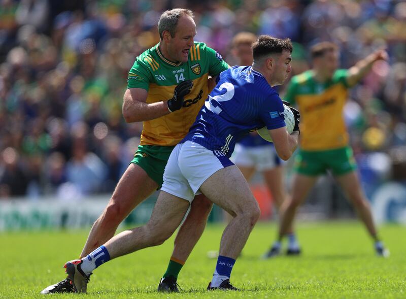Donegal's Michael Murphy tackles Niall Carolan of Cavan at Kingspan Breffni Park on Sunday. Photograph: Leah Scholes/INPHO