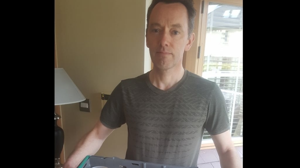 Keith Scanlon, from Delgany, Co Wicklow, is pictured with dinners for four self-isolating local people donated by his local pub.