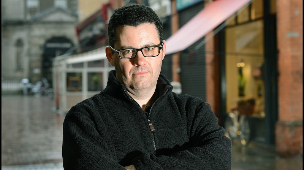 Adrian McKinty: delivers a first-person tale of cheerfully grim fatalism in “Police at the Station and They Don’t Look Friendly “. Photograph: Brenda Fitzsimons