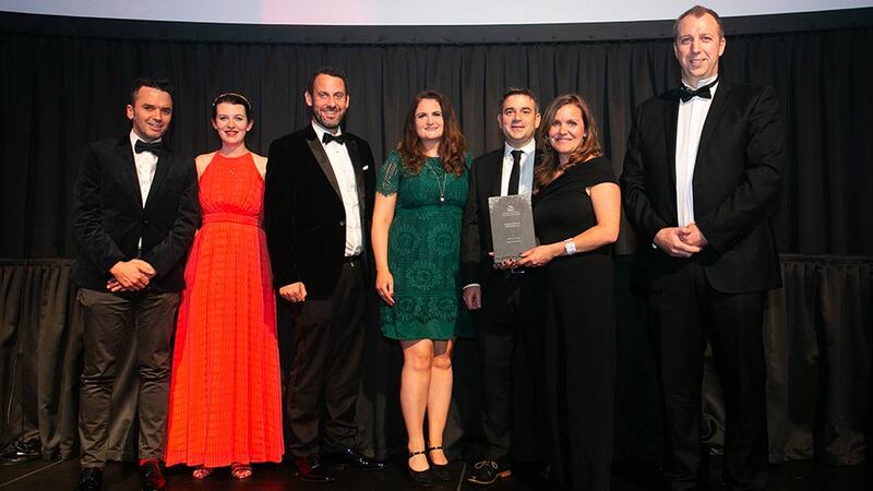 Ronan Holohan, Managing Director, MILLIMETRE DESIGN presents the House Extension Refurbishment award to the DMVF Architects Team.