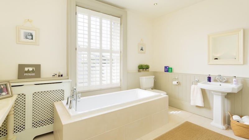 The owner sacrificed one of the bedrooms to create a really luxurious family bathroom bathed in warm western sunlight