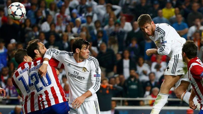 Real Madrid’s Sergio Ramos rises above the Atletico Madrid defence to score his side’s equaliser during their Champions League final at Estadio da Luz Stadium in Lisbon. Photograph: Michael Dalder/Reuters