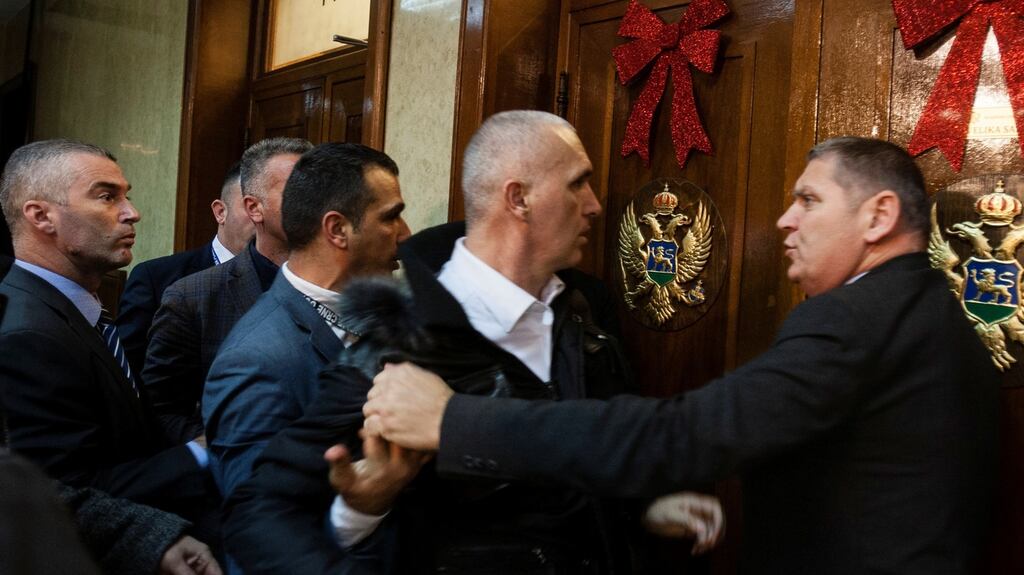 A scuffle in Montenegro’s parliament in Podgorica on December 27th after opposition tried to prevent the vote on a Bill on religious freedoms and legal rights of religious organisations. Photograph: Stevo Vasiljevic/Reuters