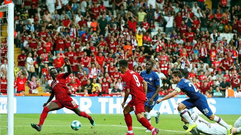 Liverpool’s Sadio Mane scores the second half equaliser. Photo: Tolga Bozoglu/EPA