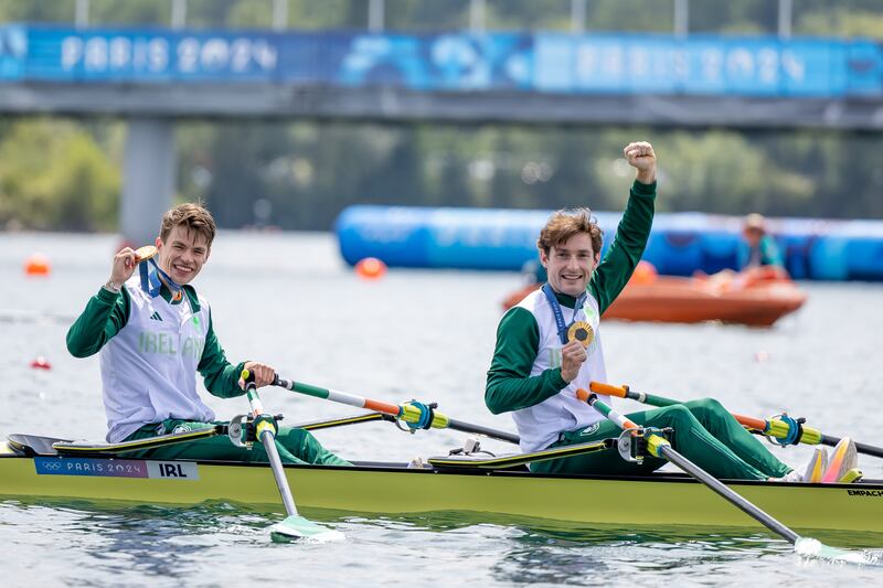 Paris 2024 Olympics: Ireland’s Fintan McCarthy and Paul O’Donovan celebrate with their gold medals. Photograph: Morgan Treacy/Inpho
