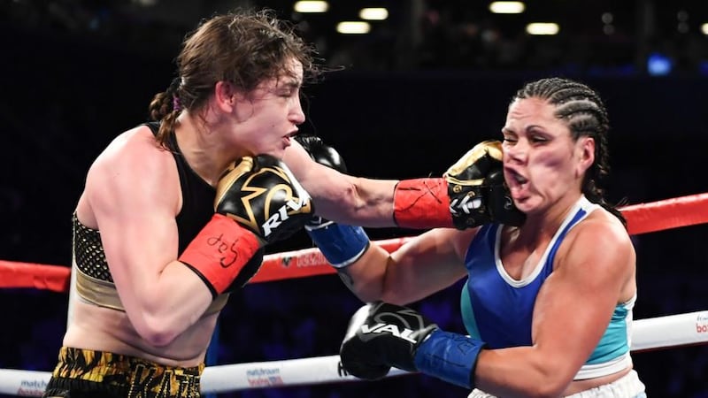 Katie Taylor catches Victoria Bustos with a left hook durnig her victory in New York. Photograph: Matt Heasley/Inpho