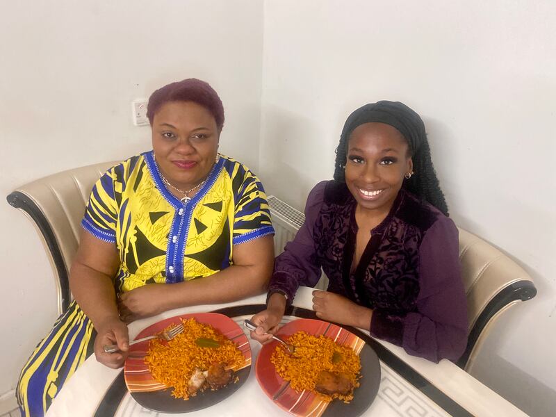 Adesewa Awobadejo with her mother Oyin eating jollof rice at their home in Drogheda, Co Louth