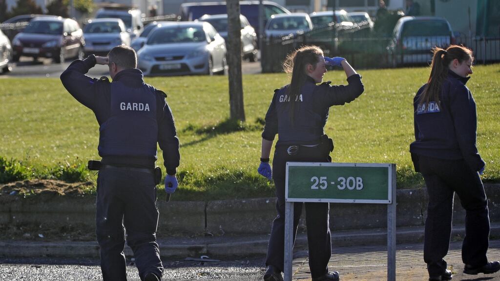 Gardaí conduct searchs of vehicles, drains and houses on Corduff Grove. Photograph: Colin Keegan/ Collins