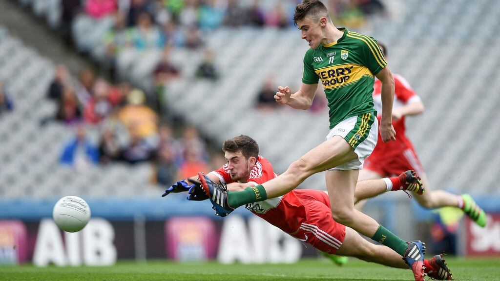 Kerry’s Seán O’Shea scores a goal despite the block attempt from Geared McLaughlin of Derry during the All-Ireland Minor Football Championship quarter-final at Croke Park. Photograph: Tommy Greally/Inpho