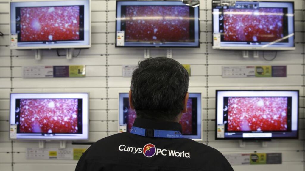Dixons Retail, whose Currys chain sells everything from tablets to vacuum cleaners, agreed to an all-share merger of equals with Carphone Warehouse Group in May. Photographer: Simon Dawson/Bloomberg