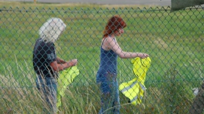 Shannon Watch file handout photograph of TD’s Mick Wallace and Clare Daly during their alleged attempt to search two planes believed to be used by the US military at Shannon Airport. Photograph: Edward Horgan/Shannon Watch/PA Wire