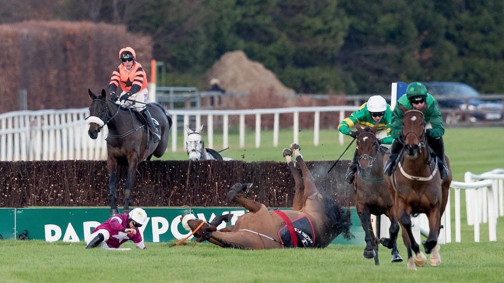 Paul Townend on Footpad on his way to winning The Racing Post Novice Steeplechase  as Davy Russell falls on Death Duty at the last. Photograph: Morgan Treacy/Inpho