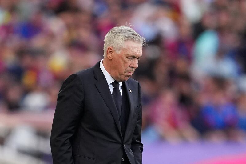 Carlo Ancelotti, head coach of Real Madrid, looks dejected during the La Liga match between FC Barcelona and Real Madrid at Estadi Olimpic Lluis Companys on Sunday in Barcelona, Spain. Photograph: Alex Caparros/Getty Images