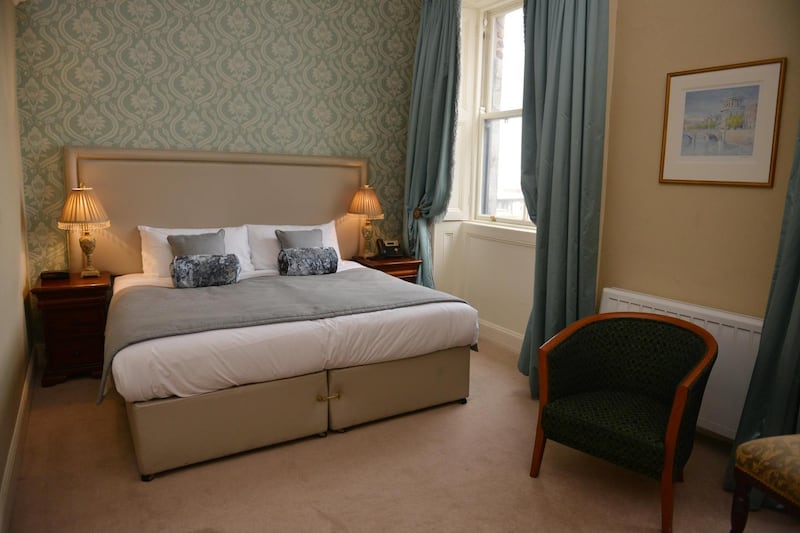 One of the bedrooms of the Stephen’s Green Hibernian Club, in Dublin. Photograph: Bryan O’Brien