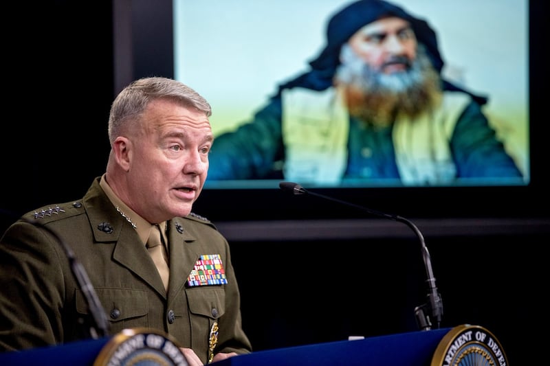 Abu Bakr al-Baghdadi is displayed on a monitor as US Central Command commander Kenneth McKenzie speaks at a joint press briefing at the Pentagon. Photograph: AP Photo/Andrew Harnik
