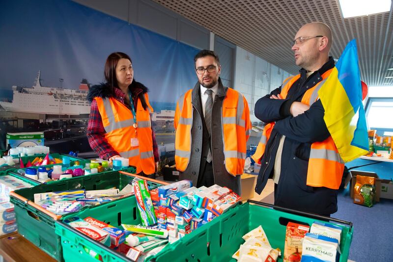 Dmytro Shchedrin (centre) talks to Tetyana Buhera and Victor Danylyuk who are co-ordinating with aid for Ukraine. Photograph: Patrick Browne