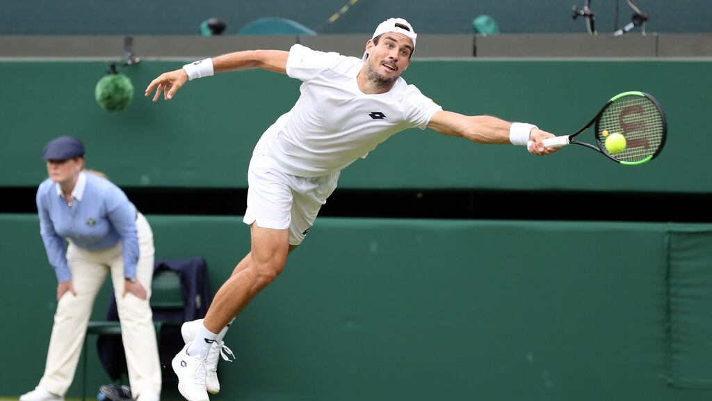 Argentina’s  Guido Pella  returns to Marin Cilic of Croatia in their second-round match at  the Wimbledon Championships. Photograph: Sean Dempsey/EPA