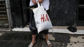 Retailer H&M feels the pinch as strong dollar boosts costs