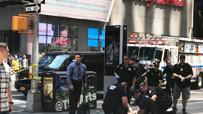 First responders assist injured pedestrians after a vehicle struck pedestrians on a sidewalk in Times Square in New York, US. Photograph: Jeremy Schultz/Reuters