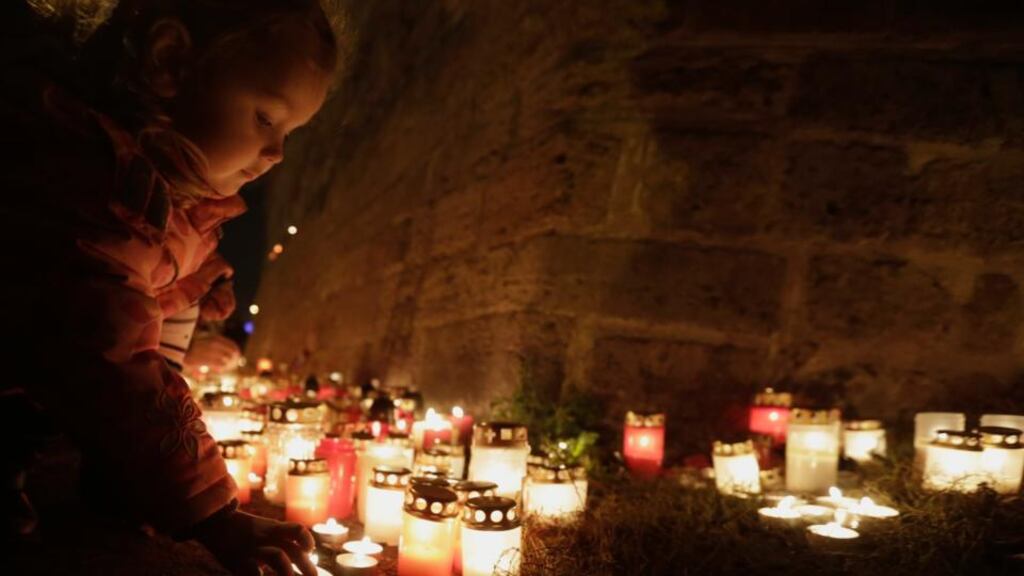 A girl lights a candle during Latvian Freedom Fighters’ Remembrance Day, or Lacplesis Day, to commemorate those who fought in the 1919 Latvian War of Independence, near Riga castle on November 11th. In Latvia, Russia’s increased military activity is seen as an echo of the cold war. Photograph: Ints Kalnins/Reuters