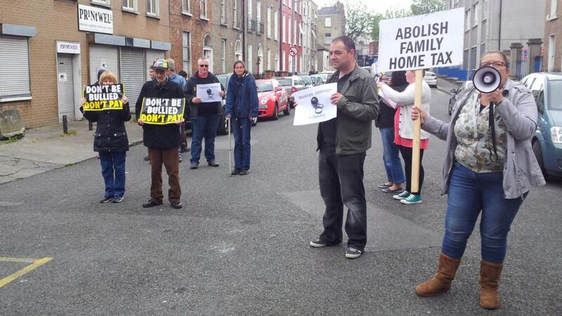 A number of protesters opposed to the property tax and  to job bridge  rallied outside. Photograph: Éanna Ó Caollaí/The Irish Times