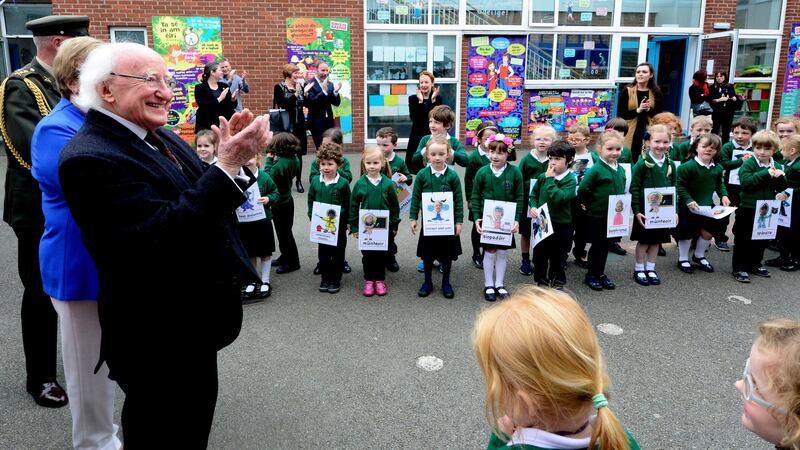 President Michael D Higgins applauds pupils at Scoil Bhríde. Photograph: Cyril Byrne/The Irish Times