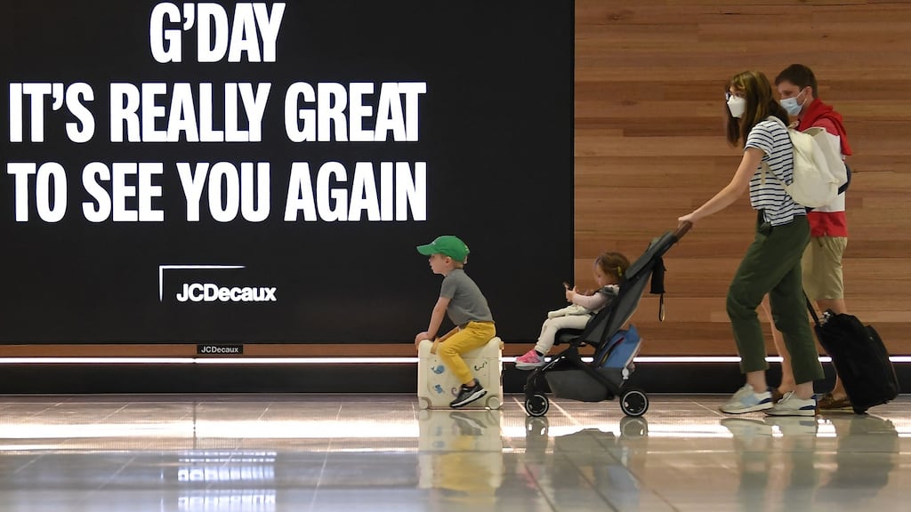 A family leave to board a plane at Sydney’s International Airport on November 1st, 2021, as Australia’s international border reopened to Australians and residents. A return of tourism begins next week. Photograph: Saeed Khan/AFP via Getty Images